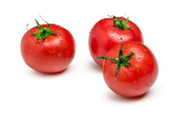 Three ripe  tomatoes isolated on white background
