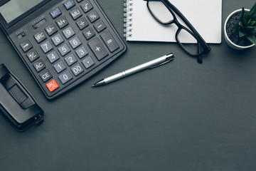 Business still life with calculator on table in office.