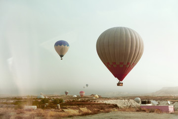 Fototapeta na wymiar Travel. Beautiful Hot Air Balloon Flying In Sky Above Valley