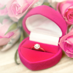 diamond engagement ring into a pink rose