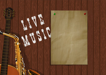 Musical background live music with wooden boards, acoustic guitar, saxophone and a piece of paper for an inscription or image.