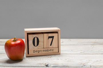 September 7th. Image of september 7 wooden color calendar on wooden background. Autumn day. Empty space for text