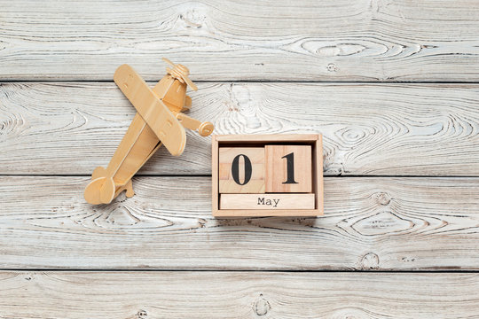 May 1st. Image of may 1 wooden color calendar on wooden background. Spring day, empty space for text. International Workers' Day