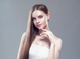 Beautiful hair smooth brunette woman beauty portrait healthy skin and haistyle 