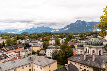 Salzburg panorama with old town and Alps on horizon.