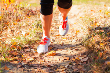 Close view of legs of running girl