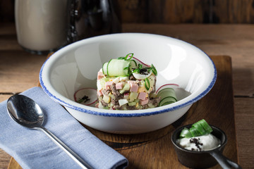 Okroshka with kvass or kefir. Traditional meal of the Russian cuisine. Prepared by chef