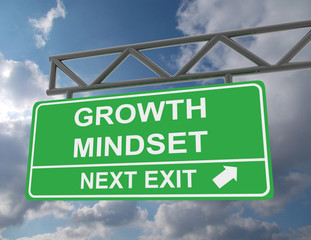 Green overhead road sign with a Growth Mindset