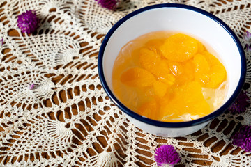 Orange with  ice in Glass bowl on cloth