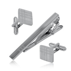 Set of silver tie clip and cuff links isolated on white