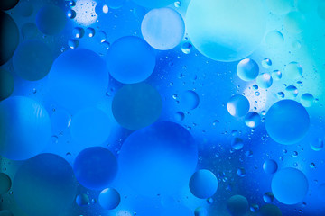 water drops on glass with colorful background, close-up 