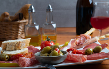 Italian antipasto on a white dish