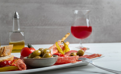 Italian antipasto on a white dish