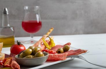 Italian antipasto on a white dish