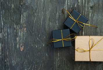Christmas gift boxes on a rustic wooden background