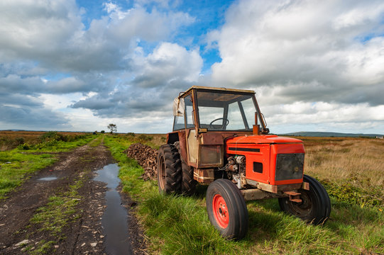 Old Rusty Tractor In A Peat Bog Landscape, Rural Ireland 