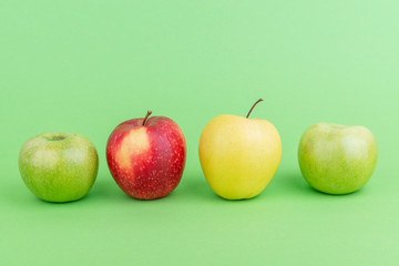 Sett of apples on light green background.