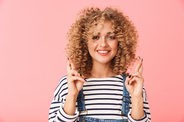 Cheerful young woman with curly hair
