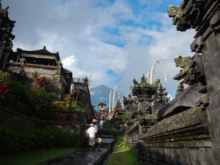 Fototapeta na wymiar Locals in Bali hiking up Mt Agung to the temple
