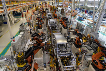 body of car on conveyor top view. Modern Assembly of cars at the plant. The automated build process...