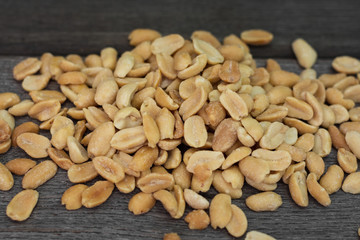 Peanuts on grey wooden table