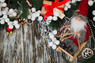 Christmas still life with decorative Santa and gift box.