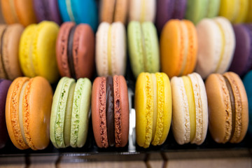 close up of colorful macaroons as background