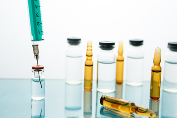 Obraz na płótnie Canvas Medical Vaccine vial hypodermic injection treatment disease care in hospital and prevention illness.