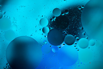 water drops on glass with orange and pink background, close-up 