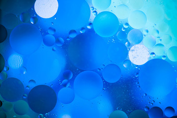 water drops on glass with orange and pink background, close-up 