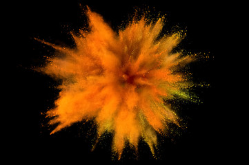 Colored powder explosion. Abstract closeup dust on backdrop. Colorful explode. Paint holi
