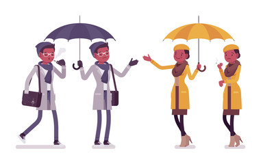 Stylish black man, woman in autumn clothes with umbrella