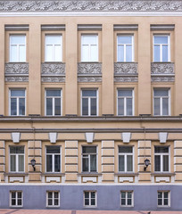 Obraz premium Vintage architecture classical facade four-storey building. Front view .