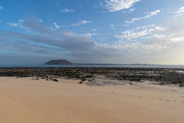 Fototapeta na wymiar Lobos island, morning view seen from Corralejo Beach on Fuerteventura, Canary Islands, Spain