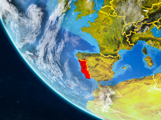 Portugal on planet Earth from space with country borders. Very fine detail of planet surface and clouds.