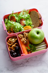 Lunch box with salad and healthy food for work and school