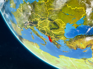 Albania on planet Earth from space with country borders. Very fine detail of planet surface and clouds.