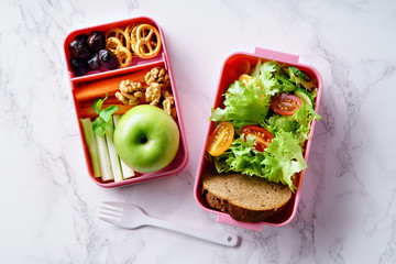 Lunch box with salad and healthy food for work and school