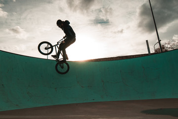 BMX rider doing tricks. Urban extreme sports