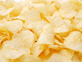 natural potato chips golden on a white background.