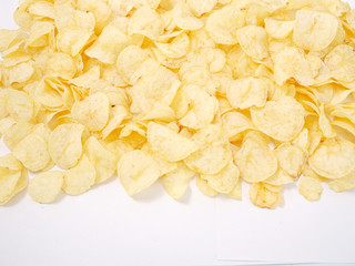 natural potato chips golden on a white background.