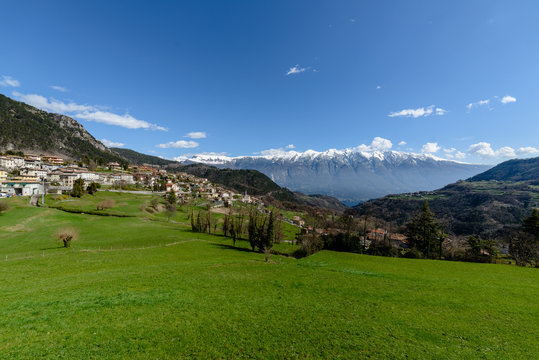 Panoramic view from Vesio village on Monte Baldo mountain range and Garda Lake on a clear spring day