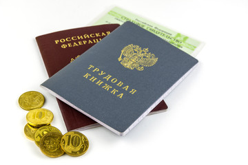 Russian documents. Work book, employment record, a document to record work experience. Russian national passport. Certificate of pension insurance, and several coins. On white background.