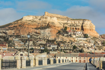 General view of San Esteban de Gormaz, wineries and above its medieval castle (Soria, Spain)