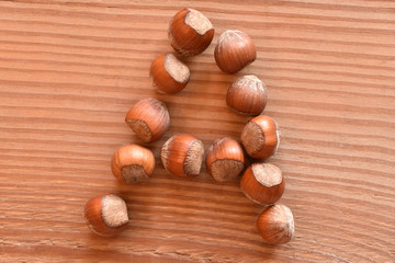 the letter A made with hazelnuts