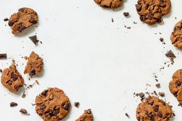 Baked Christmas cookies. Homemade Chocolate Chip Cookies on a light stone table. Top view flat lay background. Copy space.