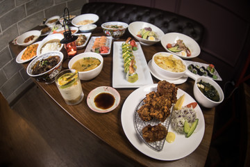 Close up view of plate with japanese food inside. Japan traditional food on wooden table.