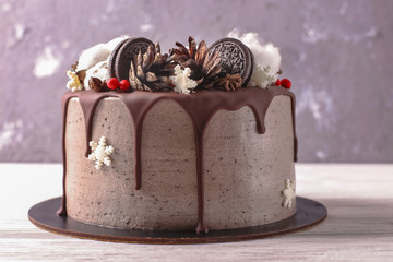 Christmas  cake with flowers and chocolate. Wedding details - wedding cake.  Winter cake with cones
