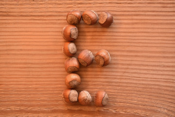 the letter E made with hazelnuts