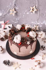 Christmas  cake with flowers and chocolate. Wedding details - wedding cake.  Winter cake with cones